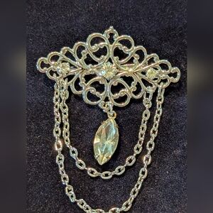 Elegant Silver Brooch with Chain Detailing